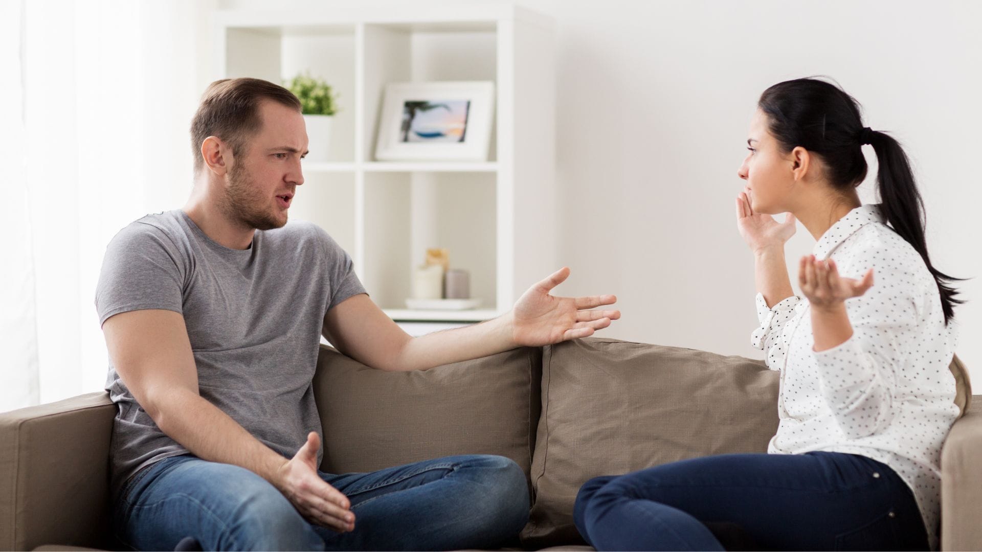 Illustration: A couple sitting on a sofa, engaged in an argument with each other.